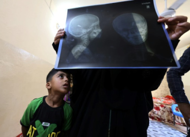 Iraq counts cost of stray bullets fired in anger or joy.jpg