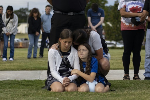 Father charged along with son, 14, in US school shooting