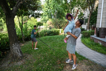 China's 'full-time dads' challenge patriarchal norms.jpg