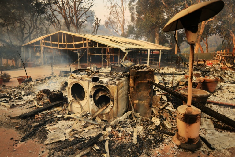 Wildfire in Malibu destroys homes, sends thousands fleeing