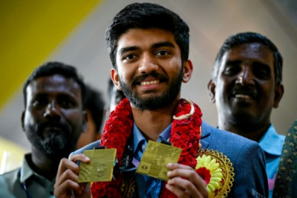 Indian teen with chess world at his finger tips.jpg