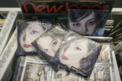 K-pop fans take aim at CD, merchandise waste.jpg