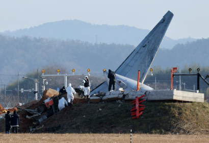 Officials investigate the site where a Jeju Air Boeing 737-800 aircraft crashed and burst into flames at Muan airport Officials investigate the site where a Jeju Air Boeing 737-800 aircraft crashed and burst into flames at Muan airport