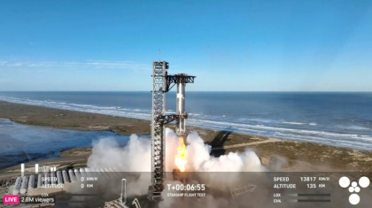 In this screen grab taken from the SpaceX broadcast the Starship's Super Heavy Booster is grappled mid-air as it returns to the launch pad at Starbase near Boca Chica, Texas, on January 16, 2025