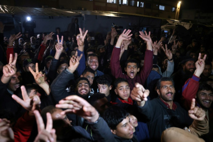 People in southern Gaza celebrate the announcement of a deal to end the 15-month war with Israel