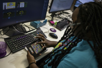 A worker plays a video game in Maliyo office in Lagos on January 20, 2025