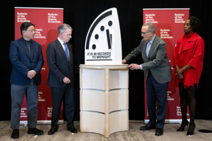 Former President of Colombia Juan Manuel Santos (second to left) and other experts unveil the Doomsday Clock at 89 seconds to midnight at a news conference in Washington