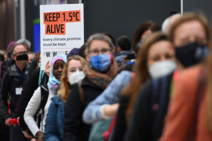 Climate activists hold a protest action during the COP26 UN Climate Change Conference in Glasgow on November 12, 2021