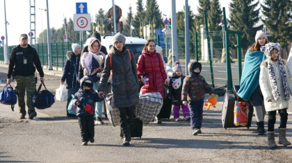 Ukrainian women and children crossing the border into Poland in 2022, following Russia's invasion