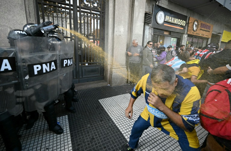 Argentine football fans clash with police at pensions march