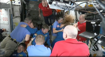 SpaceX Dragon Crew-10 members greet International Space Station crew members including NASA astronauts Butch Wilmore (L) and Suni Williams (3R) on March 16, 2025