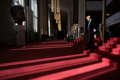 US President Donald Trump walks though the Hall of Nation as he visits the John F. Kennedy Center for the Performing Arts