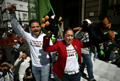 Anti-bullfighting activists celebrate a ban on killing or wounding the animals in Mexico City