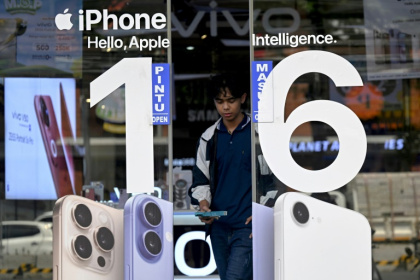 Apple chief Tim Cook says most of the iPhones brought into the United States will originate in India as the tech company tries to soften the blow from the US trade war with China - SONNY TUMBELAKA (AFP)