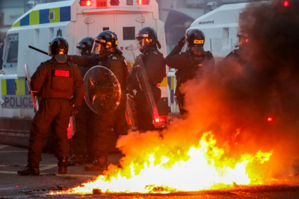 Police face protestors during a demonstration in Ballymena, Northern Ireland, sparked by the alleged attempted rape of a young girl by two teenagers - PAUL FAITH (AFP) Police face protestors during a demonstration in Ballymena, Northern Ireland, sparked by the alleged attempted rape of a young girl by two teenagers - PAUL FAITH (AFP)