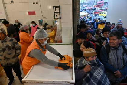 Long queues for staples, medicine and fuel have become commonplace in economically-battered Bolivia - AIZAR RALDES (AFP) Long queues for staples, medicine and fuel have become commonplace in economically-battered Bolivia - AIZAR RALDES (AFP)