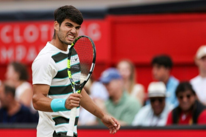 Spain's Carlos Alcaraz celebrates winning the Queen's Club title for a second time - Adrian Dennis (AFP) Spain's Carlos Alcaraz celebrates winning the Queen's Club title for a second time - Adrian Dennis (AFP)