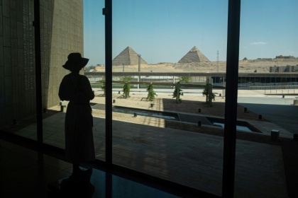 A visitor looks out towards the Giza pyramid complex as she tours the Grand Egyptian Museum in Giza on the southwestern outskirts of the capital Cairo on May 5, 2025 - Khaled DESOUKI (AFP) A visitor looks out towards the Giza pyramid complex as she tours the Grand Egyptian Museum in Giza on the southwestern outskirts of the capital Cairo on May 5, 2025 - Khaled DESOUKI (AFP)