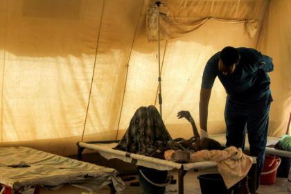 A doctor visiting a cholera patient at an isolation unit outside the Bashayer Hospital, south of Khartoum. Nearly 100,000 cases have been reported since July 2024 - - (AFP) A doctor visiting a cholera patient at an isolation unit outside the Bashayer Hospital, south of Khartoum. Nearly 100,000 cases have been reported since July 2024 - - (AFP)