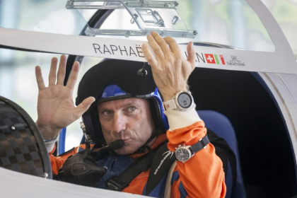 Swiss pilot Raphael Domjan waved to friends and family prior to take-off - Fabrice COFFRINI (AFP) Swiss pilot Raphael Domjan waved to friends and family prior to take-off - Fabrice COFFRINI (AFP)