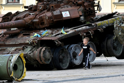 A boy walks past a destroyed tank at an open air exhibition of destroyed Russian military equipment in Kyiv on August 13, 2025, amid the Russian invasion of Ukraine - Sergei SUPINSKY (AFP) A boy walks past a destroyed tank at an open air exhibition of destroyed Russian military equipment in Kyiv on August 13, 2025, amid the Russian invasion of Ukraine - Sergei SUPINSKY (AFP)