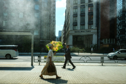 A woman with an umbrella walks in the scorching sun in Tokyo on September 1 - Philip FONG (AFP) A woman with an umbrella walks in the scorching sun in Tokyo on September 1 - Philip FONG (AFP)