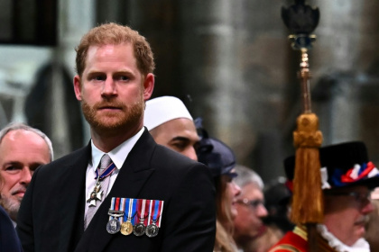 Britain's Prince Harry, the Duke of Sussex, looks on as his father leaves  Westminster Abbey after being crowned King Charles III in 2023 - Ben Stansall (AFP)