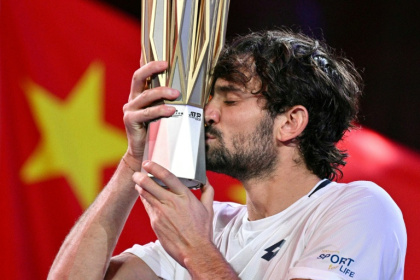 Monaco's Valentin Vacherot poses with the trophy after his victory against France’s Arthur Rinderknech - HECTOR RETAMAL (AFP) Monaco's Valentin Vacherot poses with the trophy after his victory against France’s Arthur Rinderknech - HECTOR RETAMAL (AFP)