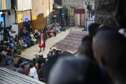 Models show off outfits created by local fashion designers specialising in upcycling discarded fabrics and garments from second-hand clothes markets - Tony KARUMBA (AFP) Models show off outfits created by local fashion designers specialising in upcycling discarded fabrics and garments from second-hand clothes markets - Tony KARUMBA (AFP)