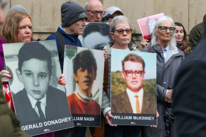 Relatives gathered outside the Belfast court at the start of the trial last month bearing posters of those killed on Bloody Sunday - Paul Faith (AFP) Relatives gathered outside the Belfast court at the start of the trial last month bearing posters of those killed on Bloody Sunday - Paul Faith (AFP)