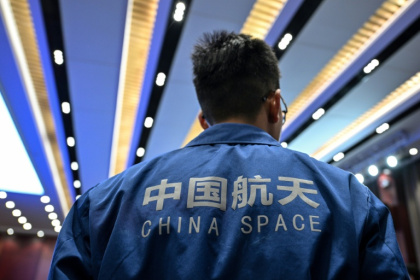 A staff member attends a press conference of the Shenzhou-21 Manned Space Mission one day before the mission's launch - Hector RETAMAL (AFP) A staff member attends a press conference of the Shenzhou-21 Manned Space Mission one day before the mission's launch - Hector RETAMAL (AFP)