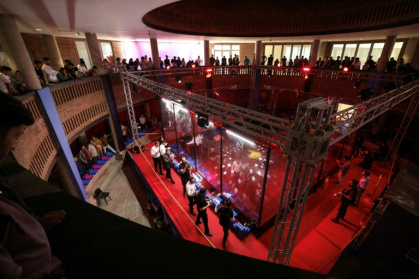 Engineering students and guests watch robots battle it out at Iran's Tech Olympics - ATTA KENARE (AFP)