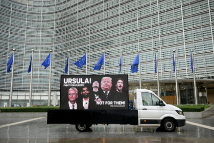 Campaigners drove across Brussels on Wednesday with large billboards calling on EU chief Ursula von der Leyen to stand up to US President Donald Trump and Big Tech - Nicolas TUCAT (AFP)