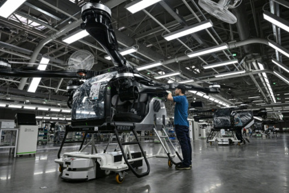 Employees work on the assembly line for the electric flying car at a factory of Xpeng's subsidiary Aridge - Jade GAO (AFP)