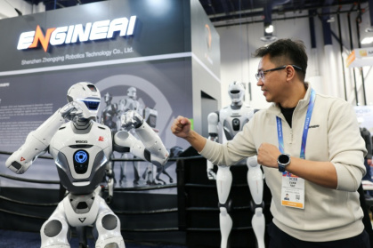 EngineAI founder Evan Yao says the China-based maker of humanoid robots is working with US tech titans such as Amazon and Meta on giving them AI brains - Patrick T. Fallon (AFP)