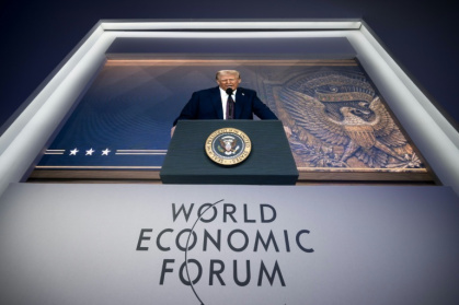 Donald Trump addressing last year's World Economic Forum in Davos via a giant video screen - FABRICE COFFRINI (AFP)