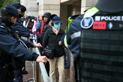 Visitors enter a court in Hong Kong on January 22 for the start of the trial of leaders of the now-disbanded Hong Kong Alliance - Peter PARKS (AFP)