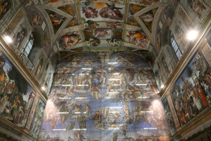 This photograph shows the scaffolding covered with a canvas reproducing Michelangelo's Last Judgment during a press visit of the rare restoration of the fresco in the Sistine Chapel in the Vatican on February 28, 2026. - Alberto PIZZOLI (AFP)