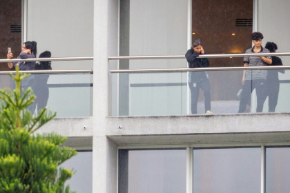 Members of the Iranian women’s football team are seen on their respective room balconies at the Royal Pines Resort on the Gold Coast on March 9, 2026 - Patrick HAMILTON (AFP)
