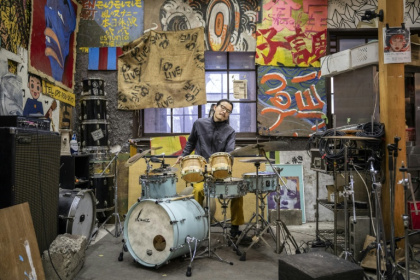 "Yoshida Dorm" is made up of two residential buildings and a heavily graffitied dining hall - Yuichi YAMAZAKI (AFP)