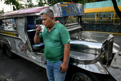 Manila's jeepney drivers, like Eric Helera, are struggling with higher diesel costs, sent soaring by the Middle East war - Ted ALJIBE (AFP)