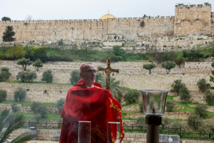 The Patriarch held Mass on the Mount of Olives after being blocked from the Church of the Holy Sepulchre - Ammar Awad (AFP)