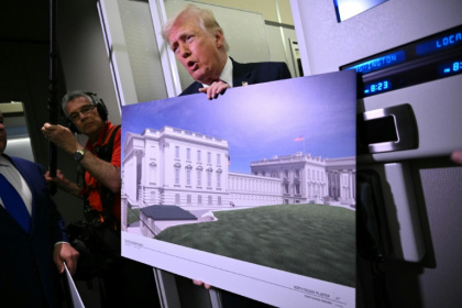 President Donald Trump showing renderings of the future White House ballroom while aboard Air Force One - Mandel NGAN (AFP)
