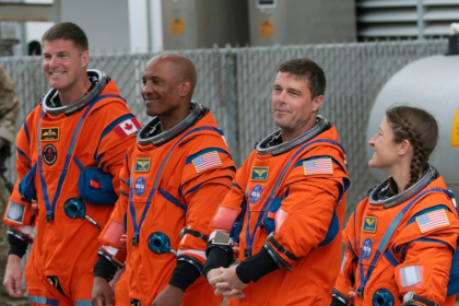 Mission specialist Jeremy Hansen, pilot Victor Glover, commander Reid Wiseman and mission specialist Christina Koch are on track to travel further from Earth than any other humans - JOE RAEDLE (AFP)