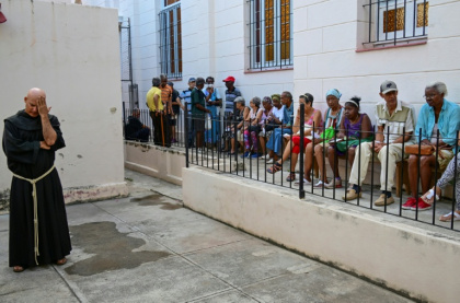 Elderly people in crisis-hit Cuba queue outside a Catholic Church in Havana for free medicine, which they can no longer obtain in pharmacies or hospitals - YAMIL LAGE (AFP)
