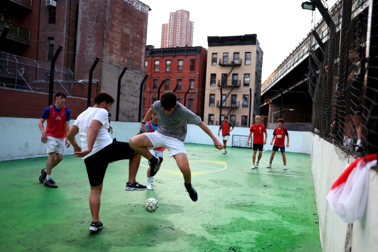 Kicking off: New York football enthusiasts defy pitch shortage