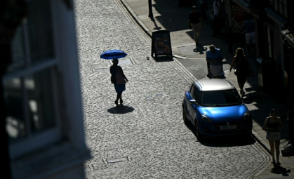 The UK broke the record for its hottest ever June day during last month's heatwave - JUSTIN TALLIS (AFP)