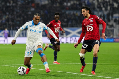 Ayyoub Bouaddi (R) playing for Lille last season against Marseille's Quinten Timber. Both players moved to the Premier League in the summer transfer window, with Bouaddi joining Manchester City in one of the biggest deals - Pascal POCHARD-CASABIANCA (AFP)
