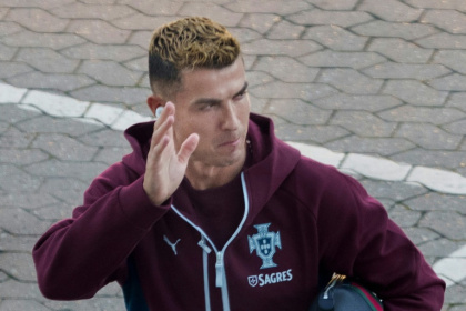 Cristiano Ronaldo waves as he arrives for a training session with the Portugal team at the Parken stadium in Copenhagen on Wednesday - Liselotte Sabroe (AFP)
